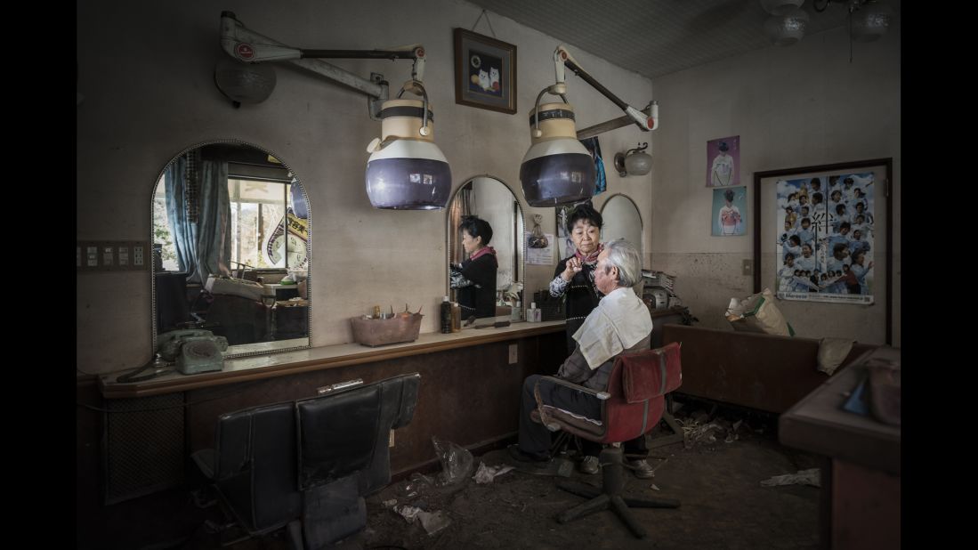 Hidemasa and Michiko Otaki are staged in Tomioka, a town hit hard by the tsunami and evacuated after the nuclear accident. "After the accident, we moved from shelter to shelter, I started cutting hair and one day talking with another refugee, she told me that a house was available in the Nakoso neighborhood of the city of Iwaki. This is where I live for over two years now."