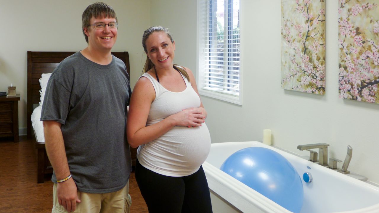 Dana Schrenk, 31, and husband Jon Ruth, 36, at Baby & Co new birthing center - partly owned by Wake Med - in Cary, North Carolina on September 15, 2015. Schrenk tried to use the tub to deliver her baby, but she was born on the bed. Baby & Co runs a chain of five outpatient birthing centers in Colorado, Tennessee, Arkansas and North Carolina.
