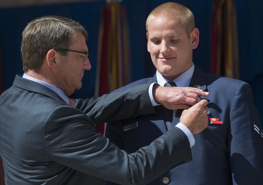 Airman 1st Class Spencer Stone, right, receives the Airman's Medal from Defense Secretary Ashton Carter in Washington on September 17 for his role in disarming a gunman on a Paris-bound train in August.