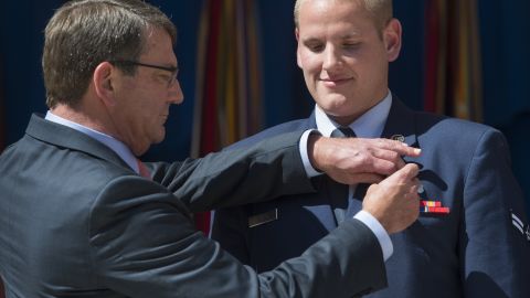 Airman 1st Class Spencer Stone, right, receives the Airman's Medal from Defense Secretary Ashton Carter in Washington on September 17 for his role in disarming a gunman on a Paris-bound train in August.
