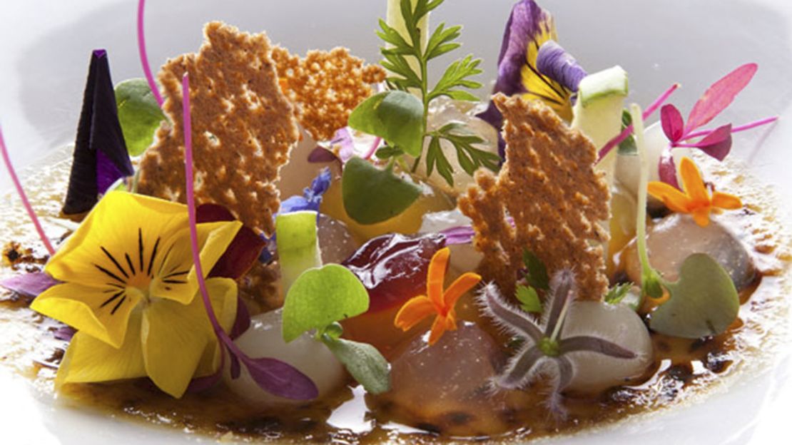 Crème brûlée with fruit, gingerbread and edible flowers.