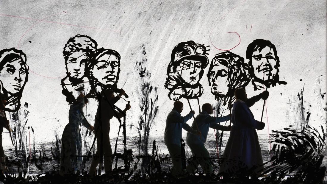 The 15-minute film combines real-life actors, South African Kentridge's charcoal drawings, cardboard silhouette cutouts, and animation. The precession is set to the sound of a brass band, creating a surreal playfulness. 