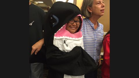 Zoey Lambe-Hommel, 7,  protested in an orca costume.