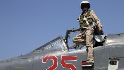 In this photo taken on Saturday, Oct.  3, 2015, Russian army pilot poses at a cockpit of SU-25M jet fighter at Hmeimim airbase in Syria.  Russia has insisted that the airstrikes that began Wednesday are targeting the Islamic State group and al-Qaida's Syrian affiliates, but at least some of the strikes appear to have hit Western-backed rebel factions.(AP Photo/Alexander Kots, Komsomolskaya Pravda, Photo via AP)