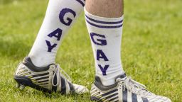 Berlin Bruisers captain Colin Comfort wears socks reading "Gay" on them during a training with Welsh rugby player Gareth Thomas on May 23, 2014 in Berlin. Founded in April 2012, the Bruisers have already attracted plenty of support from Berlin's gay community with 500 members and 35 active players training three times a week. AFP PHOTO / CLEMENS BILAN        (Photo credit should read CLEMENS BILAN/AFP/Getty Images)