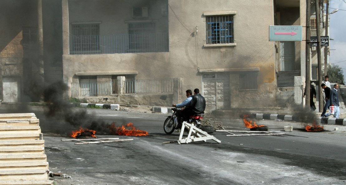 Protesters clash with Syrian security forces on the streets of Daraa in March 2011.