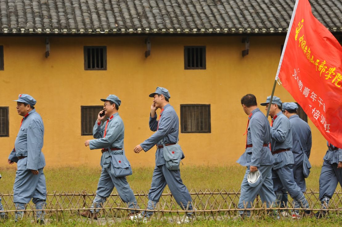 Red tourism is big business in China. Here, tourists dress up as Red Army soliders during an educational tour in Jinggangshan, the birthplace of the Chinese revolution. 