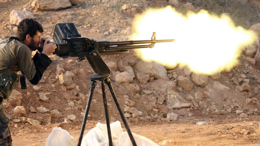 A rebel fighter fires towards pro-regime forces during clashes in Sheikh Najar area of the restive Syrian city of Aleppo on February 24, 2014. Syrian troops battled rebels over a strategic Aleppo district that could be key to securing a nearby prison and laying siege to the city's rebel-held east. AFP PHOTO / ALEPPO MEDIA CENTRE / ZEIN AL-RIFAI        (Photo credit should read ZEIN AL-RIFAI/AFP/Getty Images)