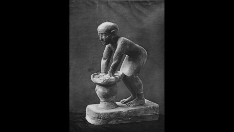 Bread and beer were staple foods in ancient Egypt and Greece. Pictured is a limestone statuette of an Egyptian servant pressing out the fermented barley-bread from which beer was brewed. 