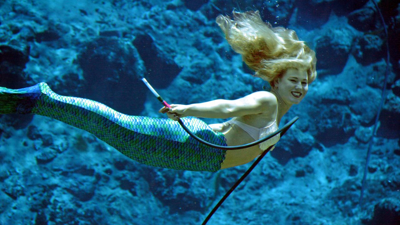 A mermaid performs at the world famous  <a href="http://www.weekiwachee.com/" target="_blank" target="_blank">Weeki Wachee Springs</a> in Florida, which hosted its first mermaid show in 1947 in a specially-built theater in a natural spring.<br /><br />The performers may be smiling but it's a grueling job that requires being able to move gracefully in cold water, with just a tube to rely on for air.