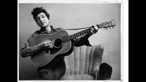 Today Bob Dylan is one of the most renowned figures in pop-music history -- a groundbreaking songwriter, a much-honored talent, an inscrutable persona. But in 1961 he was just a 19-year-old kid from Minnesota scrambling to make a living in New York's folk clubs. In September 1961, he posed for a portrait with his Gibson acoustic guitar -- around the time that Columbia Records scout John Hammond first met him at a rehearsal. Hammond signed Dylan at the end of September. Dylan's first album was six months away.