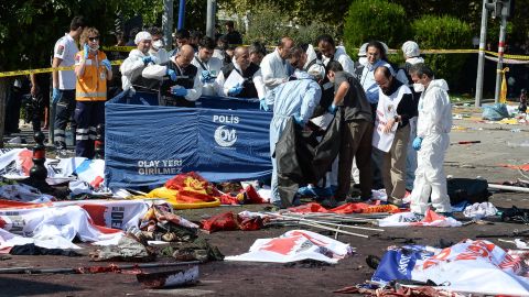 Turkish security forces and forensic police inspect the blast site.