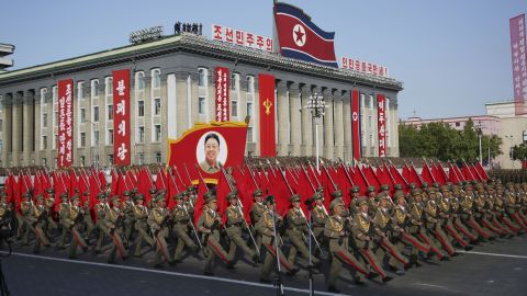 North Korean soldiers march beneath a portrait of late leader Kim Jong Il, Kim Jong Un's father, during the parade in Pyongyang.