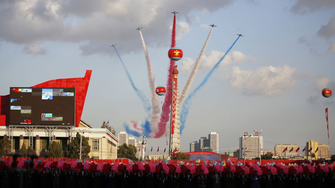 Jets fly over the Juche Tower during the parade on Kim Il Sung Square.