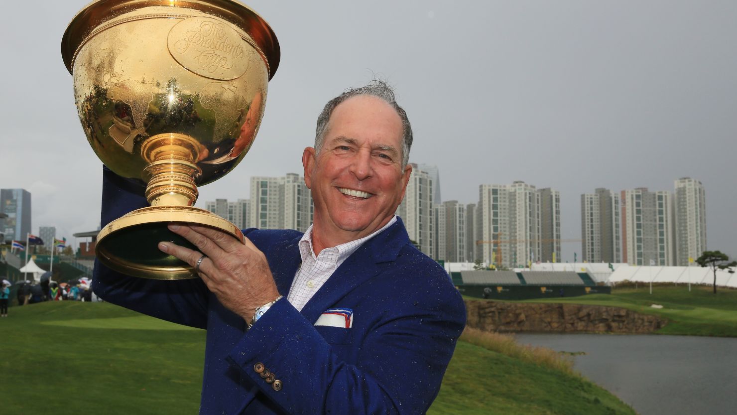 United States captain Jay Haas lifts the Presidents Cup after his team's narrow victory over the Internationals in South Korea. 