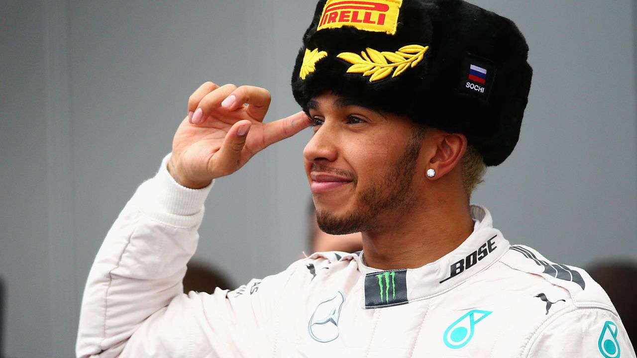 Lewis Hamilton celebrates on the podium after winning the Russian Grand Prix at Sochi. 