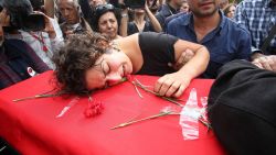A relative mourns over the coffin of Korkmaz Tedik, a board member of the Turkish Labour Party (EMEP), who was killed in twin bombings in Ankara the day before during his funeral in the capital on October 11, 2015 . Turkey woke in mourning on October 11 after at least 95 people were killed by suspected suicide bombers at a peace rally of leftist and pro-Kurdish activists in Ankara, the deadliest such attack in the country's recent history. AFP PHOTO /ADEM ALTAN (Photo credit should read ADEM ALTAN/AFP/Getty Images)