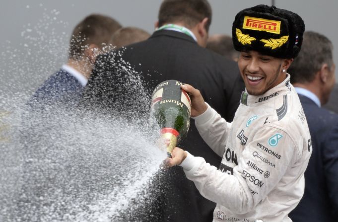 When Putin left the stage, Hamilton accidentally sprayed champagne on the back of his suit as he celebrated the victory.