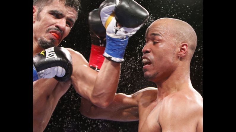 Miguel Vasquez, left, and Argenis Mendez throw punches during their lightweight bout in San Antonio on Tuesday, October 6. Mendez won by unanimous decision.