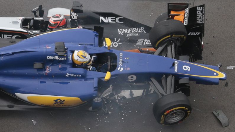 Formula One drivers Nico Hulkenberg, top and Marcus Ericsson collide during the first lap of the Russian Grand Prix on Sunday, October 11. Neither driver was hurt in the wreck, which happened when Hulkenberg spun out on a turn.