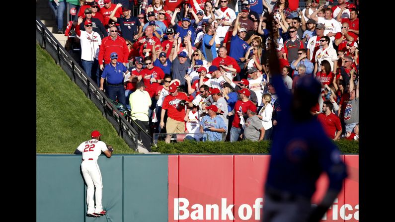 St. Louis outfielder Jason Heyward can only watch as Jorge Soler's home run lands in the stands during Game 2 of the National League Division Series on Saturday, October 2. Soler and the Chicago Cubs won 6-3 to even the series at one game apiece. The silhouette at right is Chicago's Dexter Fowler, who scored on the play.