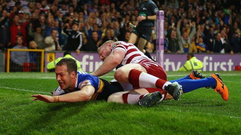 Danny McGuire of the Leeds Rhinos scores a try against the Wigan Warriors during the Super League Grand Final on Saturday, October 10. Leeds won the match 22-20 in Manchester, England.
