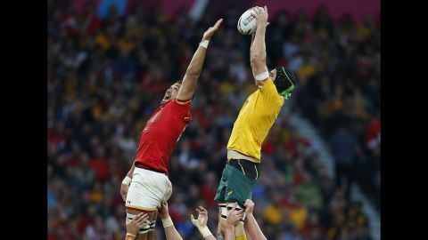 Australia's Scott Fardy, right, wins a line out over Wales' Taulupe Faletau during a Rugby World Cup match in London on Saturday, October 10. Australia won 15-6, but both teams advanced to the quarterfinals.