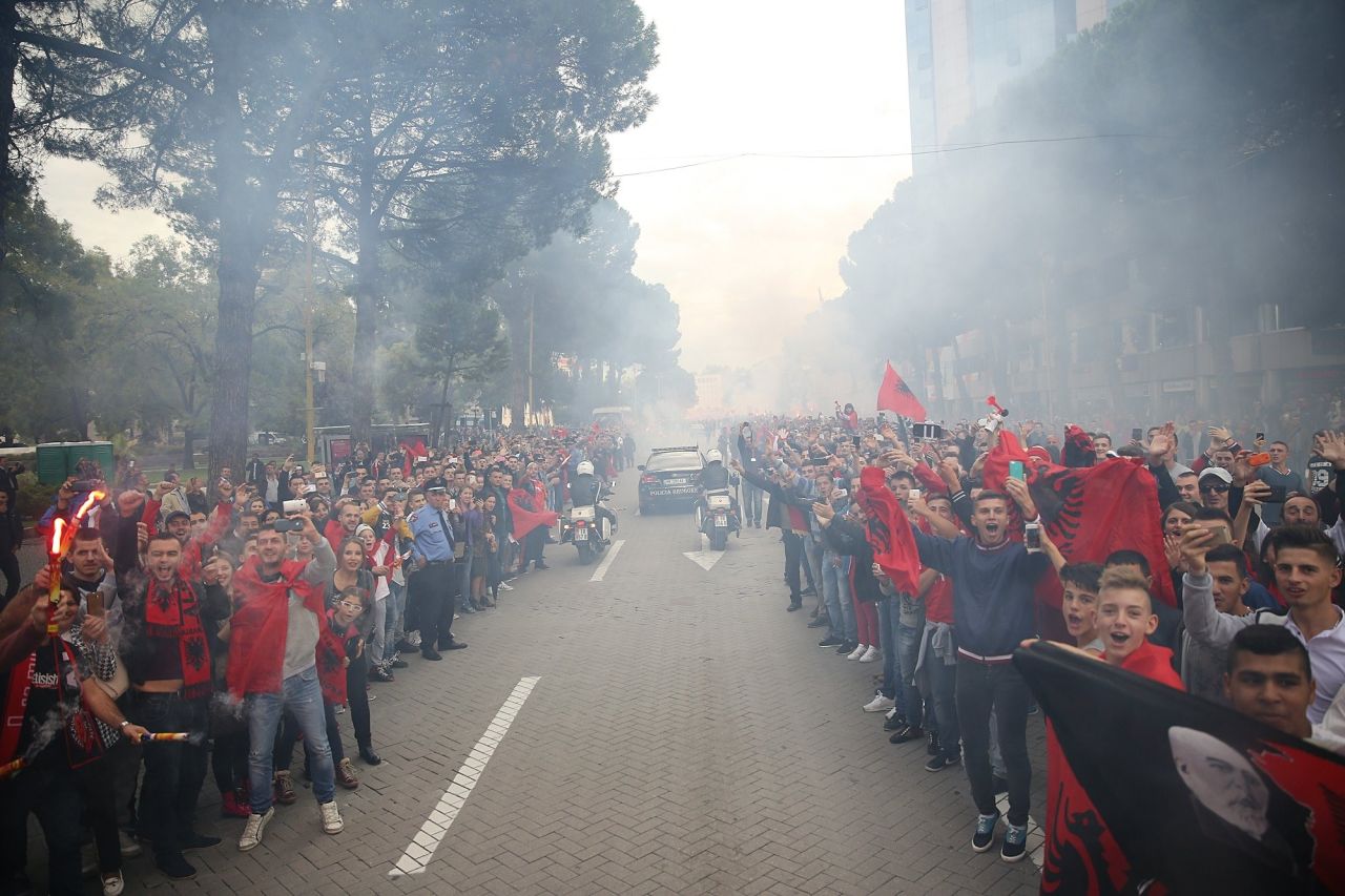 Albania's footballers touched down in Tirana Monday less than 24 hours after qualifying for the 2016 European Championship finals. Thousands lined the streets to greet them.