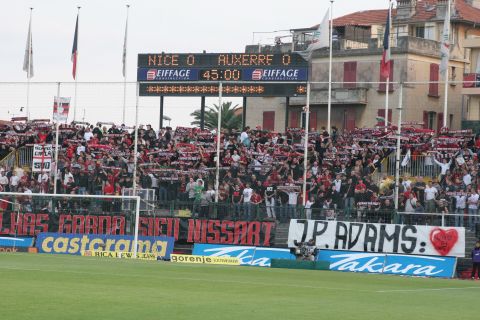 Nice fans display a banner reading "J-P Adams: One of Us" on April 28, 2007, ahead of their former player's sons -- Laurent and Frédéric -- symbolically kicking off a match against Auxerre in tribute to their father. 