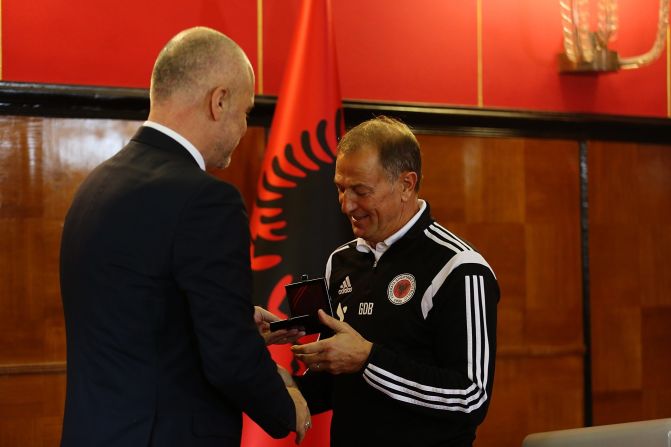 Gianni De Biasi, the team's Italian coach, was awarded the prime minister's medal after leading the team to next year's finals. Each of the players also received a medal.