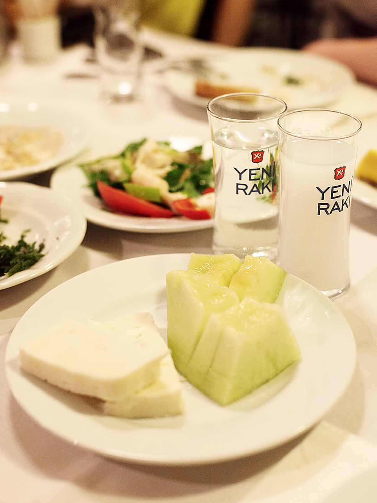 Feta and melons are the first meze to appear at a raki gathering. You don't even have to order them.