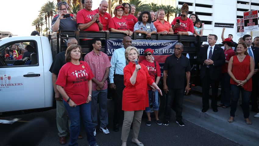 LAS VEGAS, NV - OCTOBER 12:  Democratic presidential candidate Hillary Clinton (C) speaks to union members gathered in front of the Trump International Hotel & Tower Las Vegas named and founded by the leading Republican presidential candidate Donald Trump on October 12, 2015 in Las Vegas, Nevada. Hillary Clinton is in town for a debate scheduled for tomorrow and it will be the first debate for the Democratic presidential contenders.  (Photo by Joe Raedle/Getty Images)