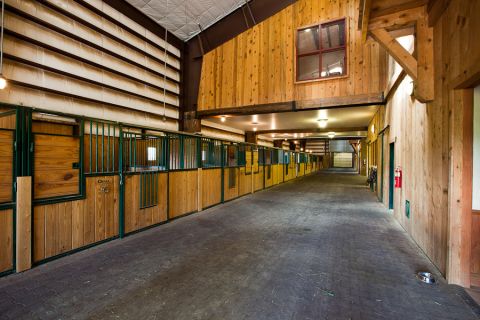 One of the stand-out features of the ranch is a 32,000 sq ft equestrian barn which includes 21 stalls and an on-site veterinary facility.