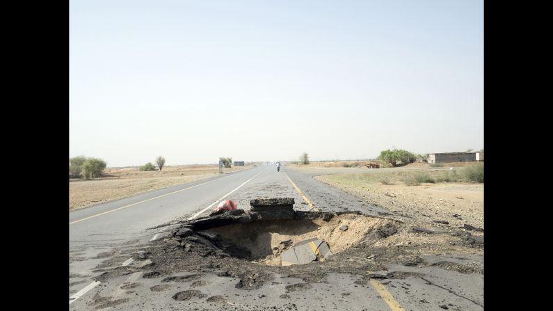 An airstrike left this crater on a road in the Hajjah Governorate.