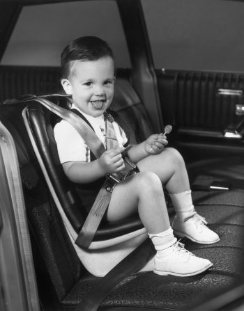 Asking "are we there yet?" isn't the only thing that road tripping parents have been dealing with since the invention of the car. Moms and dads have long been bribing kids during car rides. Exhibit A: This 1960s photo of a dapper little dude holding a lollipop in his carseat.  