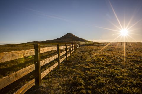 The sun sets on Ashlawn Ranch with the backdrop of Haystack Mountain.
