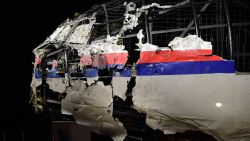 The wrecked cockipt of the Malaysia Airlines flight  MH17 is exhibited during a presentation of the final report on the cause of the its crash at the Gilze Rijen airbase October 13, 2015. Air crash investigators have concluded that Malaysia Airlines flight MH17 was shot down by a missile fired from rebel-held eastern Ukraine, sources close to the inquiry said today, triggering a swift Russian denial. The findings are likely to exacerbate the tensions between Russia and the West, as ties have strained over the Ukraine conflict and Moscow's entry into the Syrian war.   AFP PHOTO / EMMANUEL DUNAND        (Photo credit should read EMMANUEL DUNAND/AFP/Getty Images)