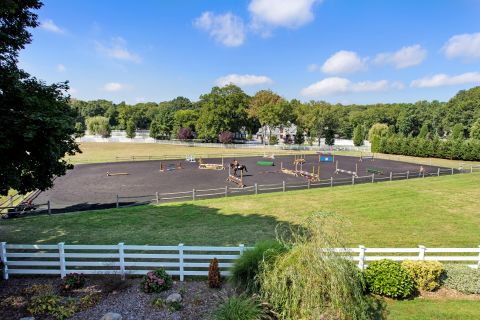 The property comes with an Olympic-sized equestrian arena for the horses ...