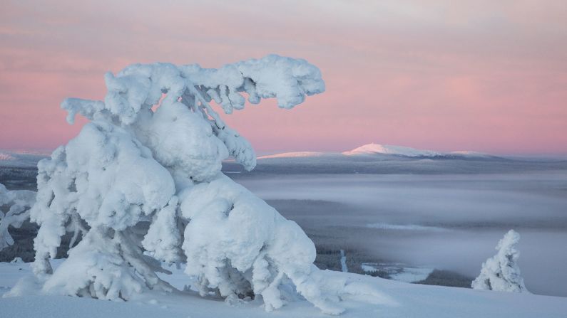 Finnish photographer Tea Karvinen took this image of the frozen Pyha Luosto National Park. She includes it in her list of the 10 most beautiful Finnish landscapes for the <a href="index.php?page=&url=http%3A%2F%2Fwww.visitfinland.com%2Farticle%2Ffinlands-ten-most-beautiful-landscapes%2F" target="_blank" target="_blank">VisitFinland.com website</a>. The photo, taken in December from the highest peak in the Pyha mountains, shows the last rays of light hitting Luosto Mountain as fog descends into the valley below.