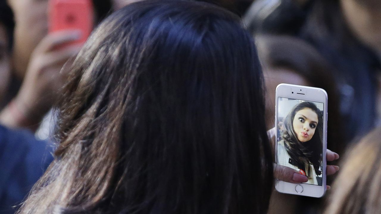 Pop star Selena Gomez takes a selfie at New York's Rockefeller Center, where she was performing for the "Today" show on Monday, October 12.