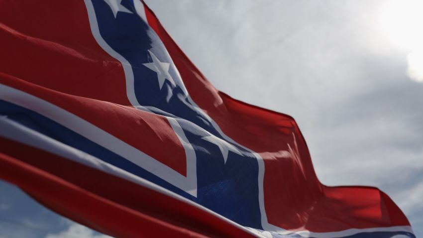 LOXAHATCHEE, FL - JULY 11:  A Confederate flag flies from a vehicle during a rally to show support for the American and Confederate flags on July 11, 2015 in Loxahatchee, Florida. Organizers of the rally said that after the Confederate flag was removed from South Carolinas State House it reinforced their need to show support for the Confederate flag which some feel is under attack.  (Photo by Joe Raedle/Getty Images)