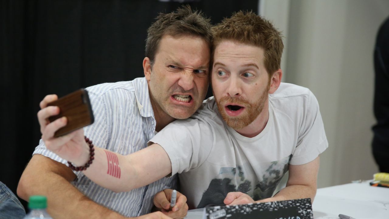 Actors Breckin Meyer, left, and Seth Green take a photo together while signing autographs at New York Comic Con on Saturday, October 10.