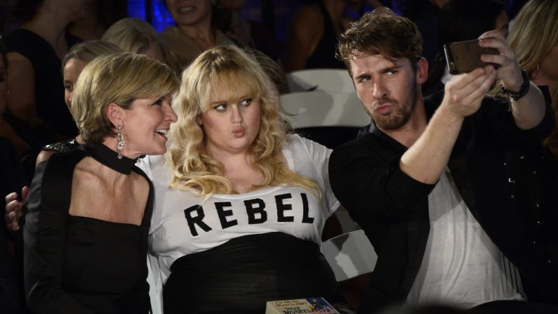 Actor Hugh Sheridan snaps a photo with actress Rebel Wilson and Australia's Minister of Foreign Affairs, Julie Bishop, while attending Los Angeles Fashion Week on Thursday, October 8. Sheridan and Wilson are both from Australia, and they were watching runway shows featuring Australian designers.