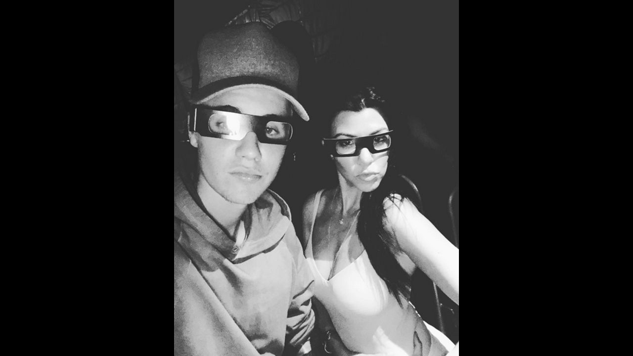 Pop star Justin Bieber and television personality Kourtney Kardashian wear 3-D glasses as they hang out at Universal Studios Hollywood on Saturday, October 10. Bieber <a href="https://instagram.com/p/8quMqQAvvo/" target="_blank" target="_blank">posted the selfie</a> to his Instagram account.