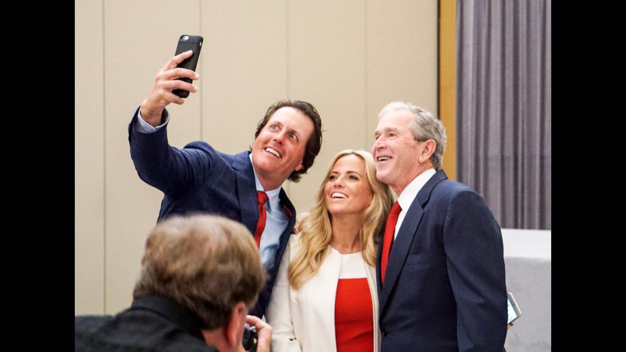 Hall of Fame golfer Phil Mickelson takes a photo with his wife, Amy, and former U.S. President George W. Bush on Wednesday, October 7. "Lefty is a righty when it comes to selfies," <a href="https://twitter.com/PGATOUR/status/651747185936068608" target="_blank" target="_blank">the PGA Tour tweeted.</a>