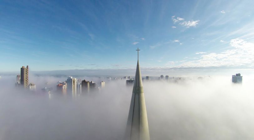 The steeple of Brazil's Maringa Cathedral can be seen peeking above the mist in this image by Ricardo Matiello. The stunning photo was also the winner of this year's <a href="index.php?page=&url=http%3A%2F%2Fwww.dronestagr.am%2Fcontest%2F" target="_blank" target="_blank">Dronestagram Aerial Photography Contest</a>, in the Places category.