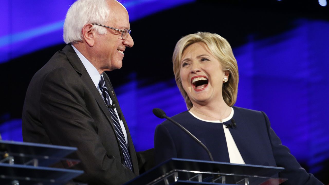 Sen. Bernie Sanders, of Vermont, left, and Hillary Rodham Clinton laugh during the CNN Democratic presidential debate Tuesday, Oct. 13, 2015, in Las Vegas. (AP Photo/John Locher)