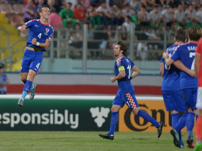 Croatia leapfrogged Norway to second place in Group H thanks to Ivan Perišić (L) hitting the only goal against Malta in the last round. It will be Croatia's third successive appearance at the finals.