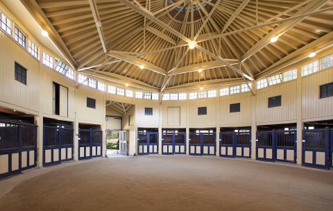 This round, 10-stall barn was built in 1928 and is one of two stables included with the property. There is also a 11,250 sq ft covered riding arena.  