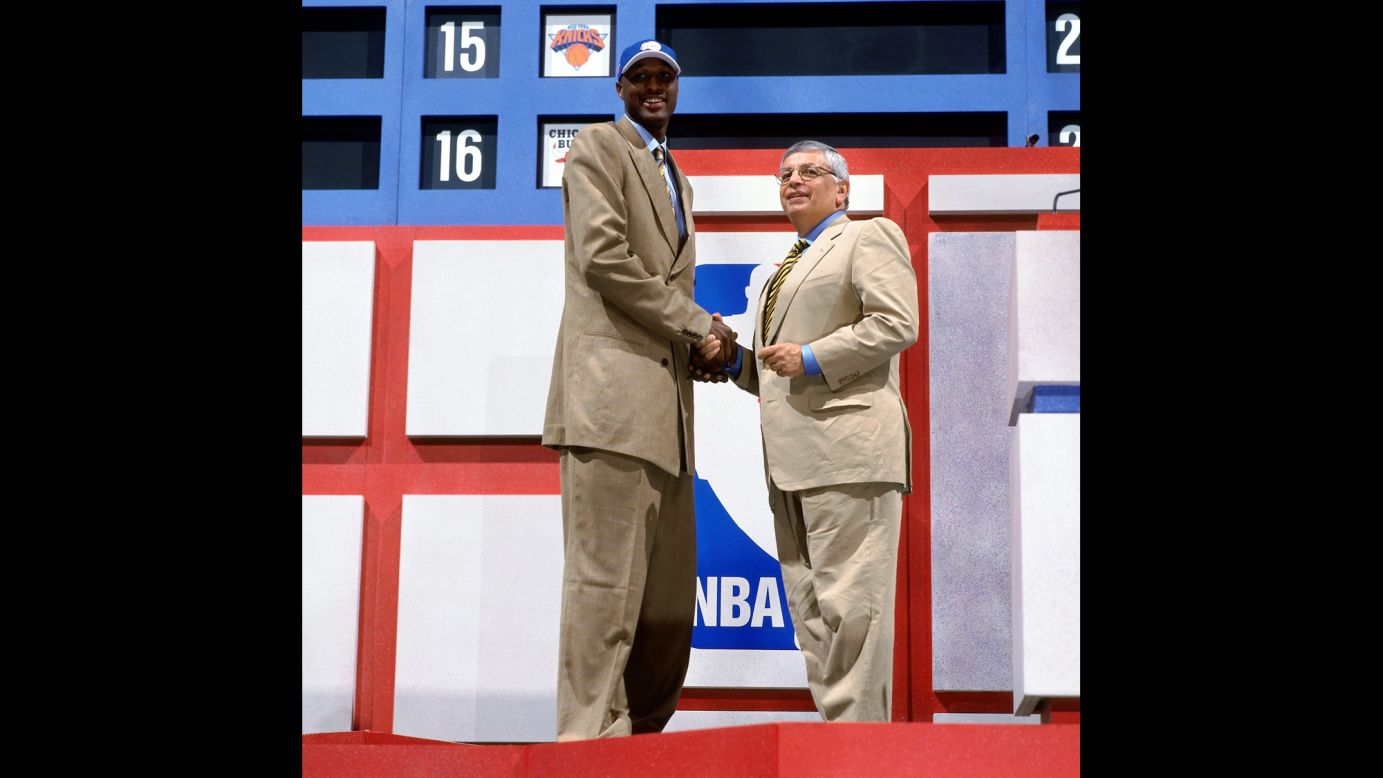 Odom shakes hands with NBA Commissioner David Stern during the 1999 NBA Draft. Odom was drafted by the Los Angeles Clippers.